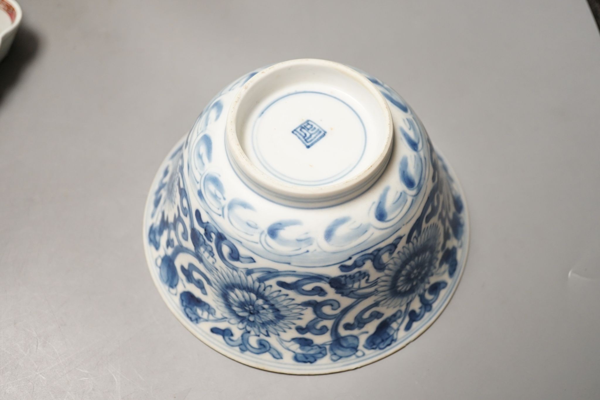 A Chinese blue and white bowl, Kangxi, 15cm. diam., a famille rose teapot stand, Yongzheng, and two doucai bowls